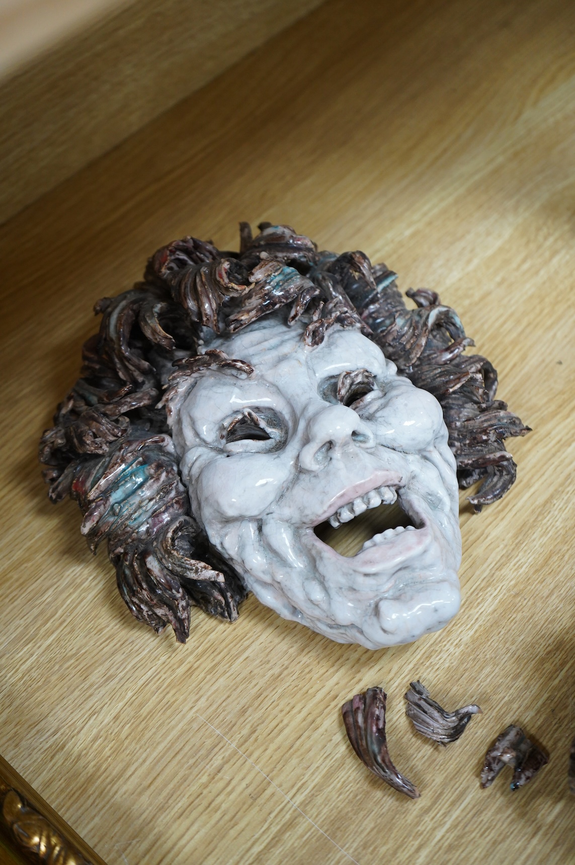 Eugenio Pattarino (1885–1971), two Italian maiolica comedy & tragedy wall masks, 30cm high